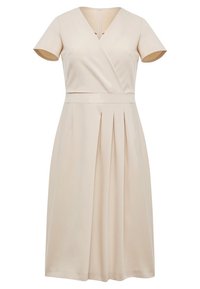 Vestido envolvente beige hecho de tela suave, con mangas cortas, falda plisada y escote en V, con un zipper trasero oculto.