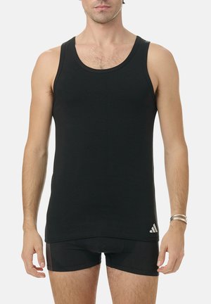 Black tank top made of soft cotton, featuring a crew neck and no sleeves. Subtle logo accent near the hem. Fitted design.