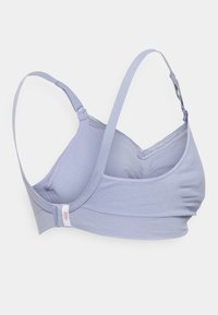 Lyselilla bh med mykt stoff, justerbare stropper og sømløs design. Har et subtilt merke på siden.