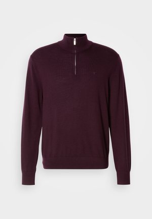 Burgundy quarter-zip sweater made of a smooth knit fabric, featuring long sleeves and a subtle logo on the chest.