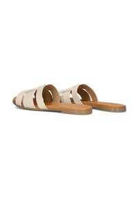 Slide-sandalen van lichtbeige synthetisch materiaal. Voorzien van drie brede banden met een textuurpatroon, een bruine binnenvoering en een platte zool.