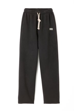 Black sweatpants made of soft fabric, featuring an elastic waistband with a drawstring and a small printed logo on the thigh.