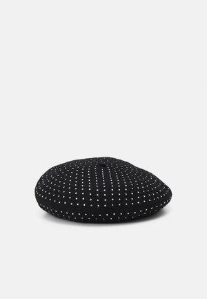 Black beret covered in evenly spaced small white studs, featuring a small fabric stem on top, placed on a plain white background.