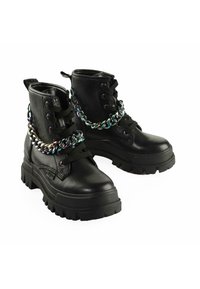 Black leather ankle boots with a chunky sole, featuring black laces and an iridescent chain accent across the front.
