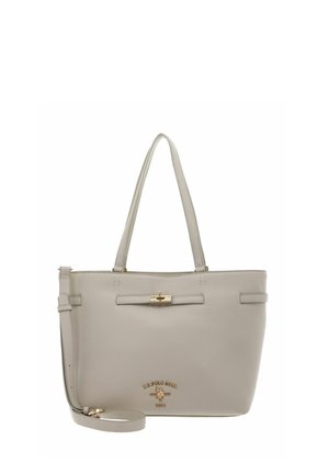 Sac cabas en cuir beige avec double poignées, bandoulière réglable, fermeture à tour dorée et logo U.S. Polo Assn. embossé.