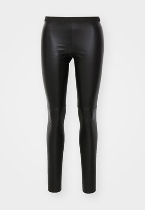 Zwarte leggings van glad, rekbaar materiaal met een hoge tailleband. Strakke pasvorm, naadloze constructie en geen zichtbare zakken.