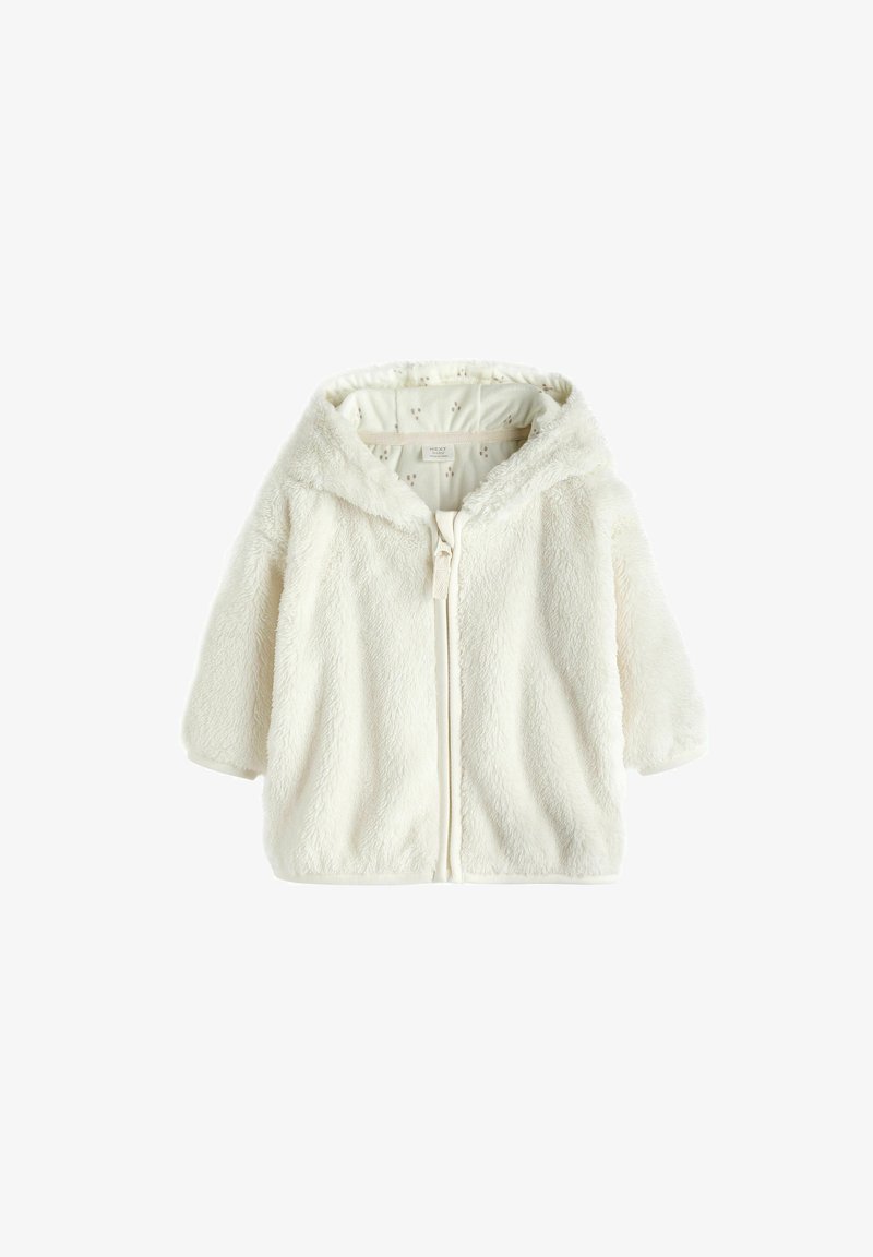 Veste à capuche en polaire blanche avec zip à l'avant, texture douce et intérieur à motifs. Dispose de manches courtes et d'un design confortable.