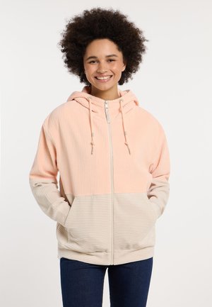 Giacca con cappuccio e chiusura a zip. Presenta una texture a coste in sezioni rosa e beige. Include tasche frontali, con coulisse regolabili.