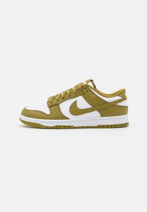 Low-top sneaker with white base and olive green overlays, lace-up closure, and a matching olive green Nike swoosh on the side.