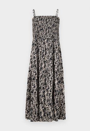 Black and beige patterned sundress with a smocked bodice and adjustable spaghetti straps, features a flowy skirt and floral motifs.