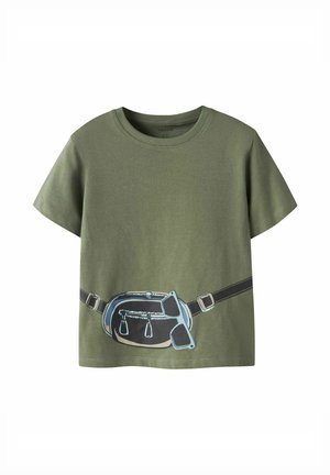 Olive green short-sleeve t-shirt with printed black belt bag and blue sunglasses across the front waist area.