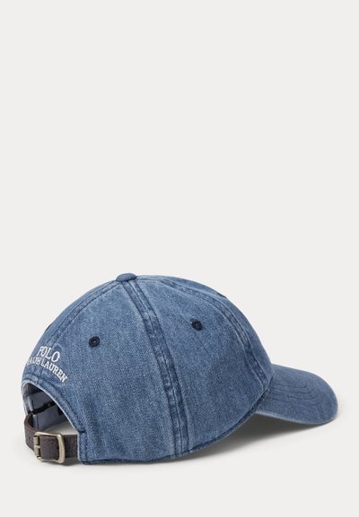 Denim blue Polo Ralph Lauren baseball cap with adjustable leather strap and embroidered brand logo on back.