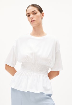 White cotton T-shirt with a relaxed fit, featuring a smocked waist and short sleeves. The bottom has a flared, gathered design.