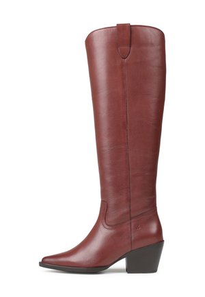Botte de cowboy en cuir brun, haute avec un bout pointu et un talon moyen empilé, avec des coutures sur le côté et une lanière de tirage en haut.