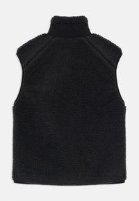 Black fleece vest featuring a high collar, sleeveless design, and textured fabric. Smooth hem and shoulder seam details for a clean finish.
