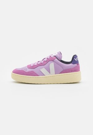 Pink and purple sneaker with suede and leather material, featuring a textured upper, white V logo, and a beige rubber sole.