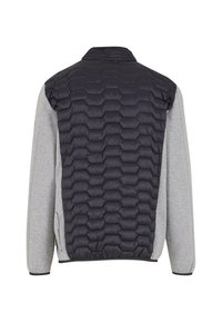 Veste matelassée avec un motif à chevrons en gris foncé et des manches en tricot gris. Dotée d'un col montant et de poignets élastiques.