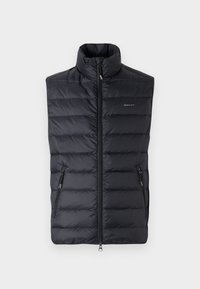 Padded black sleeveless vest with high collar, front zipper, and two side pockets. Features a subtle brand logo on the chest.