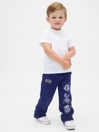 Pantalones de chándal en color navy con cinturilla elástica, logo "GAP" en multicolor y personajes de Disney impresos: Mickey Mouse, Donald Duck y otros.