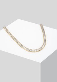 Gold-tone necklace featuring a row of rectangular clear crystals; smooth texture with a uniform design, curved shape, and secure clasp.