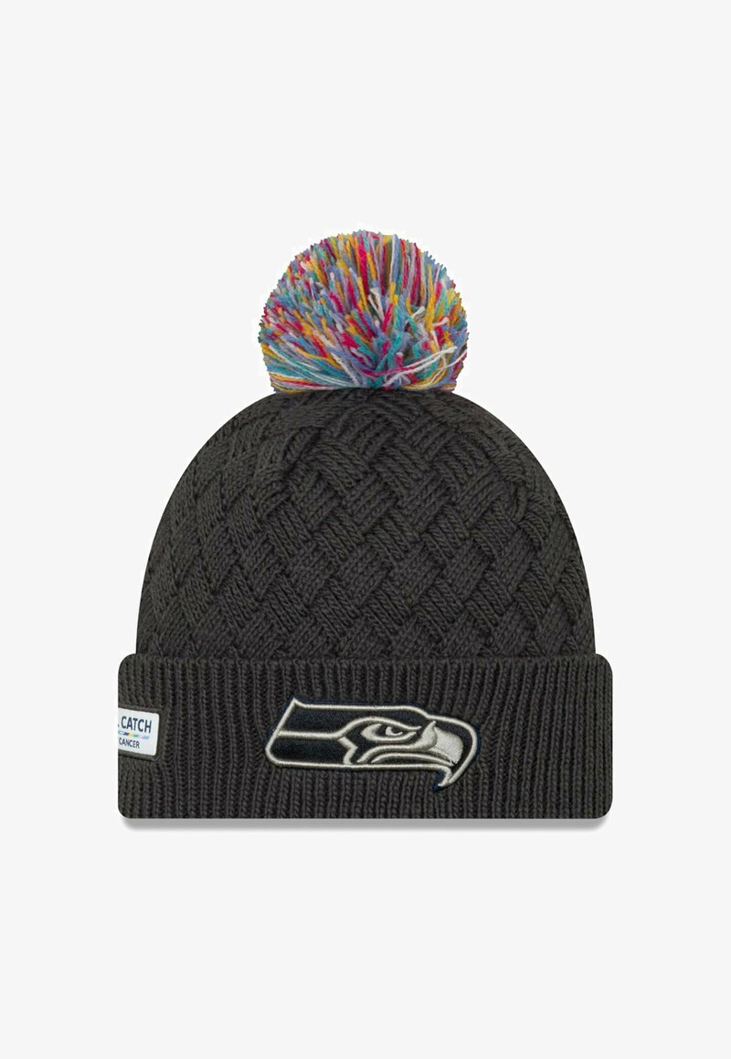 Knit black beanie with multicolored pom-pom on top. Features a woven pattern and a logo patch depicting a bird's head on the cuff.