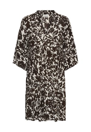 Mustvalge lillemustriga kleit, millel on V-kaelus, laiad kolmveerandvarrukad ja kihiline, lõdvestunud põlvpikkus.