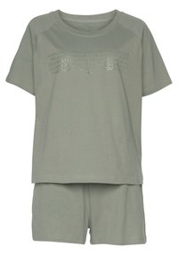 Short-sleeve, light green cotton pajamas featuring a relaxed fit, rounded neckline, and text pattern on the front; includes matching shorts.