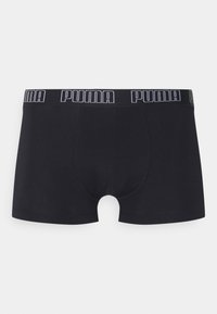 Schwarze Boxershorts mit einem Puma-Logo-Bund, enganliegendem Schnitt, glatter Textur und einem Schnitt bis zur Mitte des Oberschenkels mit einem konturierten Pouch.