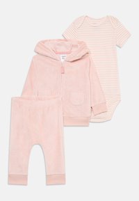 Pink fluffy zip-up hoodie with two pockets, matching pink pants, and a striped bodysuit in lighter pink and white. Soft fabric, cozy design.