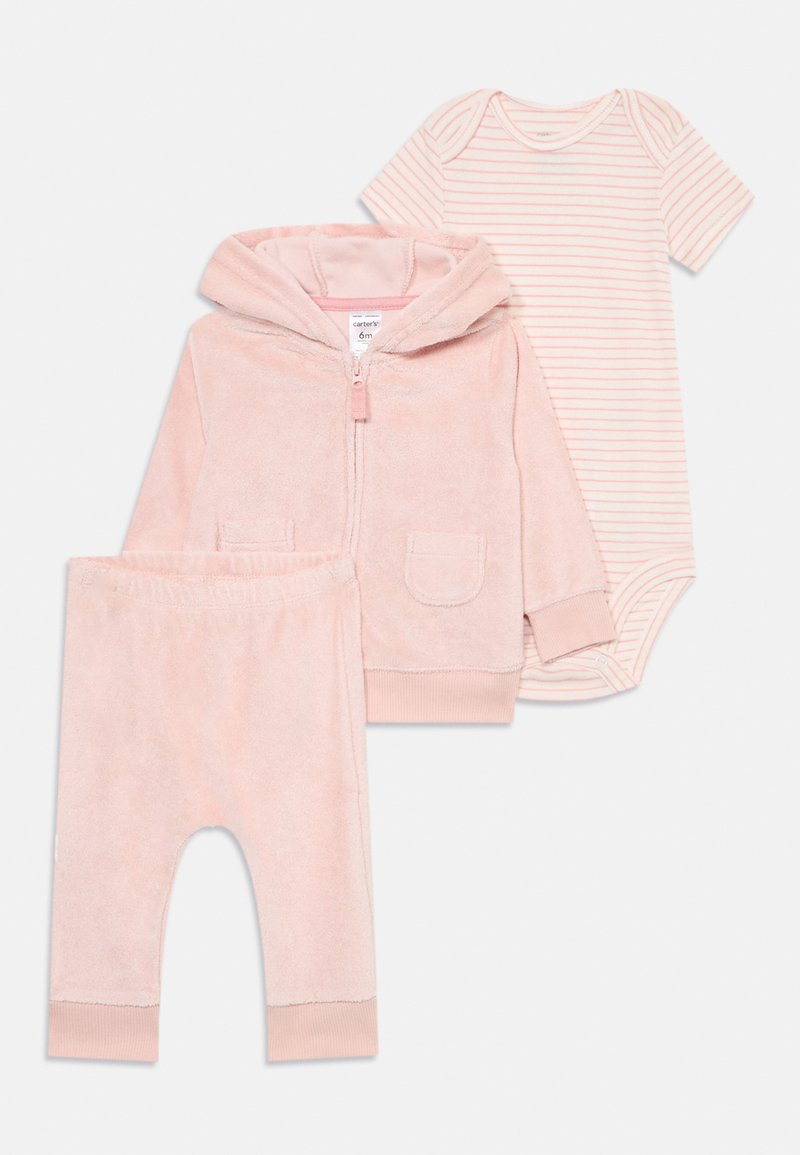 Pink fluffy zip-up hoodie with two pockets, matching pink pants, and a striped bodysuit in lighter pink and white. Soft fabric, cozy design.