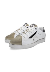 White sneakers with a smooth leather upper, suede toe cap in light gray, black side detail, flat laces, and perforated rubber soles.