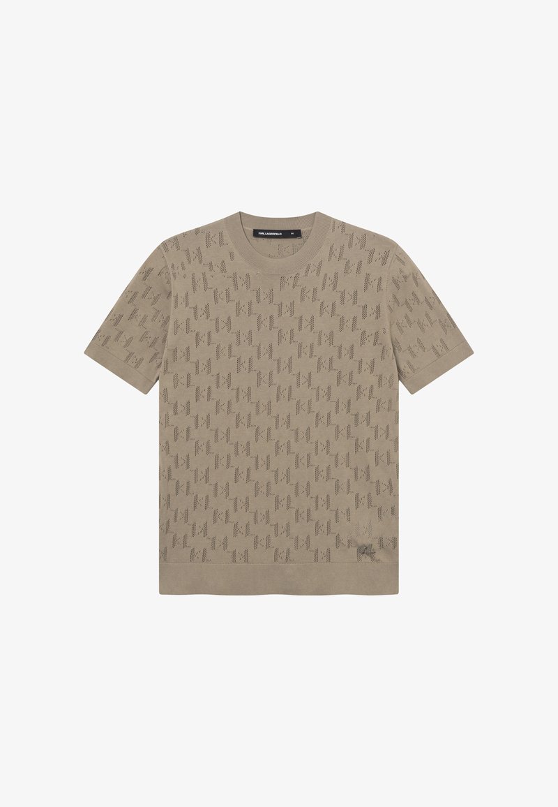 Haut en maille beige à manches courtes avec une texture subtile à motif sur l'ensemble et un col rond. Petit détail de logo près de l'ourlet.