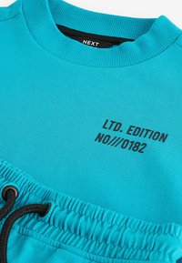 Next SHORT SLEEVE CREW SET REGULAR FIT - Træningsbukser - turquoise blue