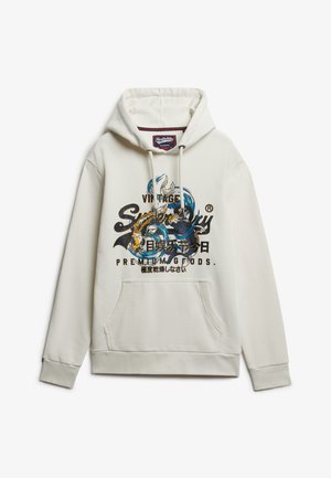 Witte hoodie met een voorzak in kangoeroestijl, een trekkoordkap en een kleurrijke grafische print met blauwe en zwarte accenten.