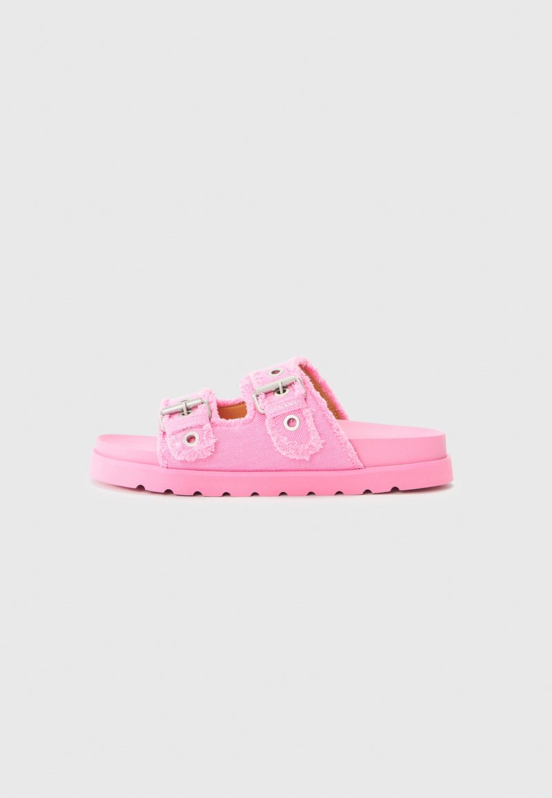 Pink slides featuring a fuzzy texture, dual adjustable straps with silver hardware, and a thick cushioned sole.