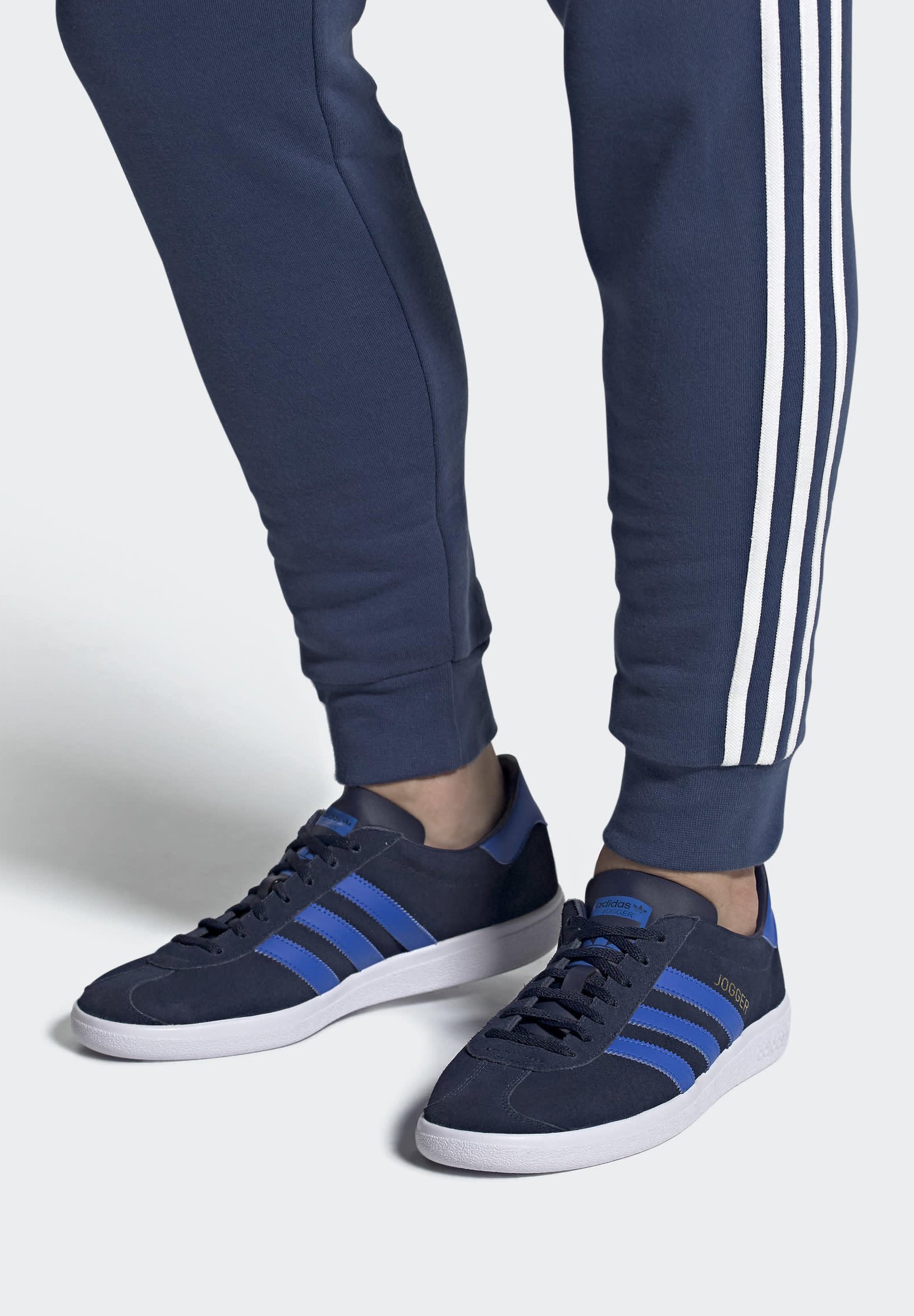 grey and blue adidas joggers