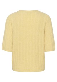 Gul ribbstickad tröja med avslappnad passform, korta ärmar och rundad halsringning. Mjuk textur och minimalistisk design.