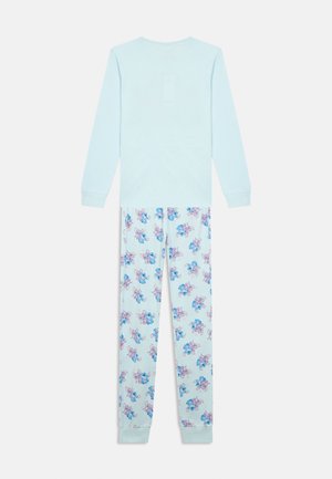 Long-sleeve light blue top with matching pajama pants featuring blue and pink cartoon characters on a white background.