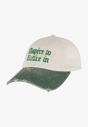 Cotton cap with a cream upper, green distressed visor, and embroidered text "Aspire to Notice." Features adjustable back strap and vent holes.