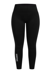 Leggings neri realizzati in un tessuto liscio e stretchy con una vita alta. Un dettaglio notevole è il testo del logo bianco sulla parte inferiore della gamba sinistra.