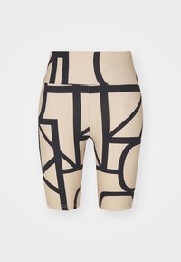 Shorts de vélo beige avec un motif géométrique abstrait noir, présentant une texture lisse et une taille mi-haute.