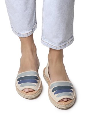Lightweight espadrille sandals with a beige base and multicolored horizontal stripes in blue and teal. Open-toe design with textured sole.