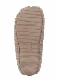 Beżowa podeszwa kapcia z fakturowaną, żebrowaną powierzchnią; krawędzie przypominające futro; wytłoczone logo na środku; oznaczona jako "Made in Spain".