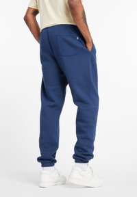 New Balance ESSENTIALS GRAPHIC - Joggebukse - nb navy