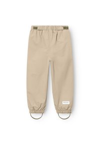 Beige wasserdichte Hose mit elastischem Bund, verstellbaren Bündchen und runden Akzenten an den Knöcheln. Glatte Textur mit minimalem Branding.