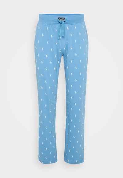 Blå bomullsloungebukser med snor i midjen og et mønster av hvite polo-logoer over hele. Stoffet er glatt med en avslappet passform.