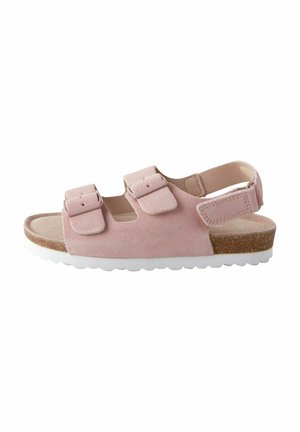 Sandalo in suede rosa chiaro con due cinture regolabili e suola in gomma bianca, con un accento in sughero sul tallone per un tocco di texture in più.