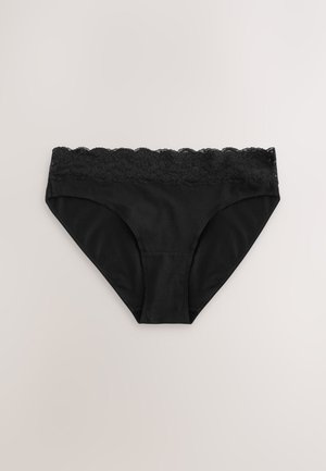 Culotte noire en tissu lisse avec une ceinture en dentelle festonnée. Présente une coupe bikini classique et un design sans coutures.