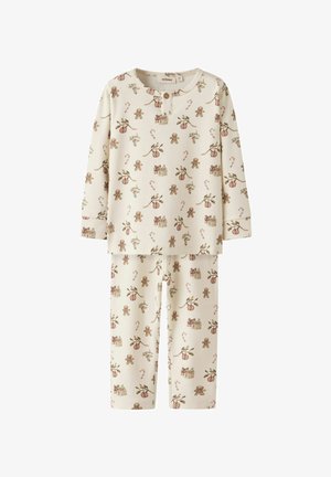 Krémový dlouhý pyžamový set s potiskem perníčků, cukrových hůlek, dárků, cesmíny a vánočních ozdob.
