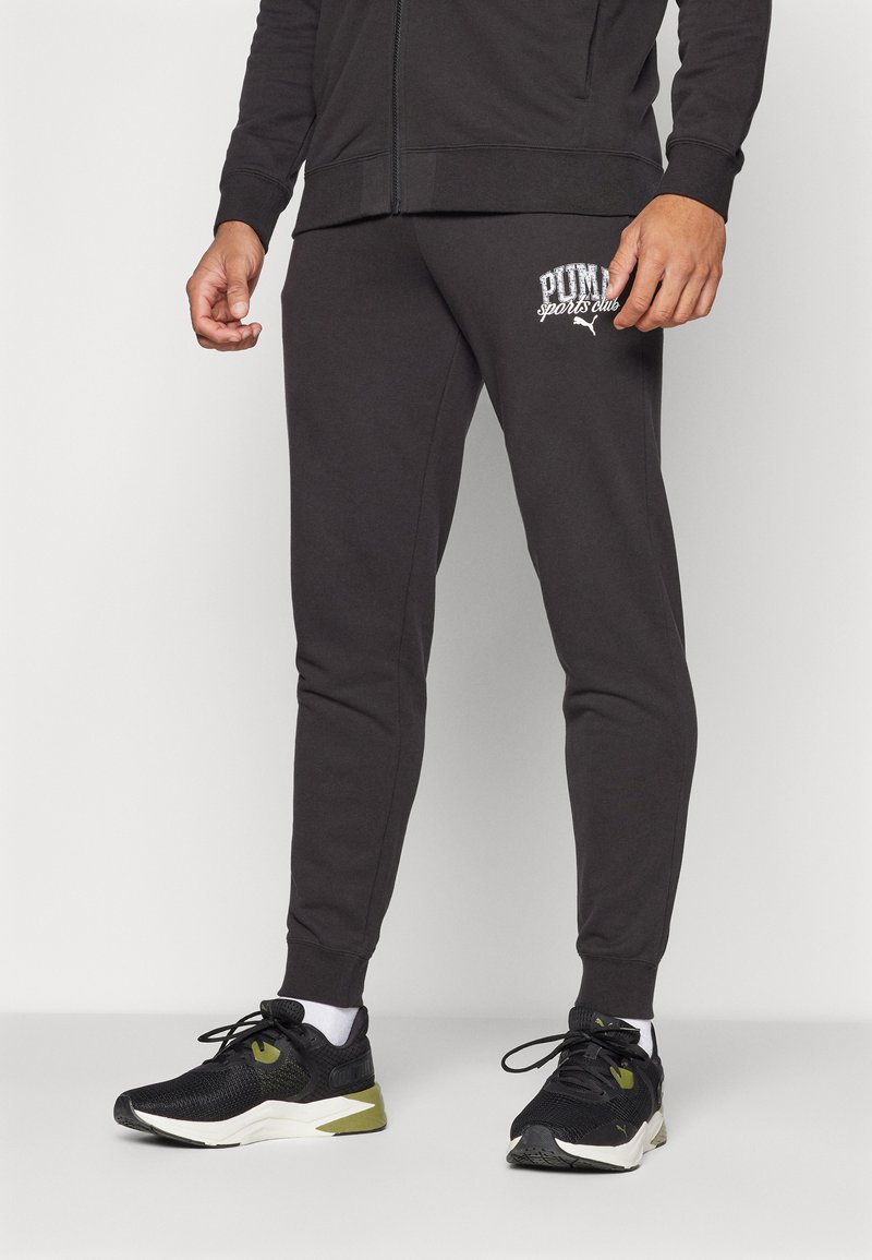 Zwarte katoenen joggers met een slim fit, voorzien van een wit PUMA-logo op de linkerdij en ribgebreide boorden voor een aansluitende pasvorm.
